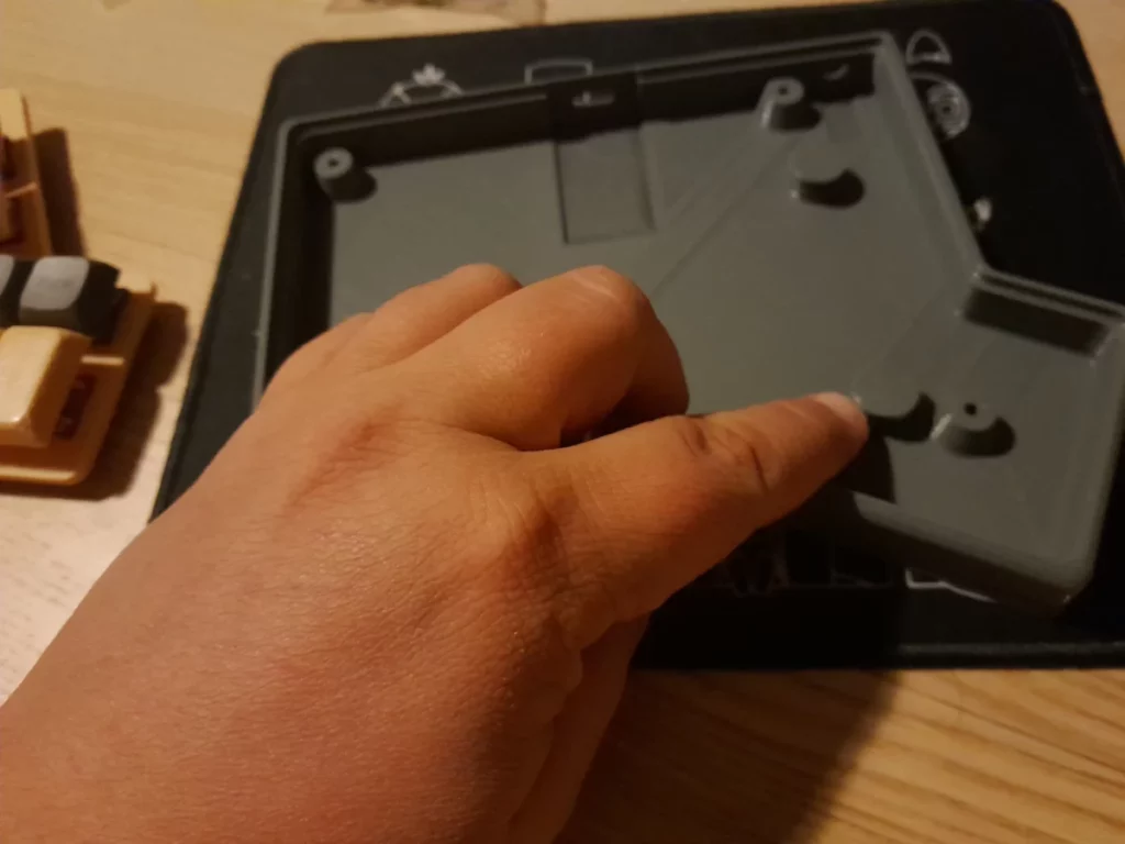 The keyboard case, with two slots for magnets printed in the mass