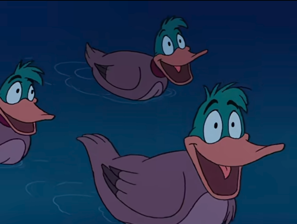 trois canards avec des têtes de daffy duck mal faits sur des corps de canards traditionnels regardent Ariel et je sais pas comment il s'appelle machin se rouler des pelles avec des grands sourires de guédros 